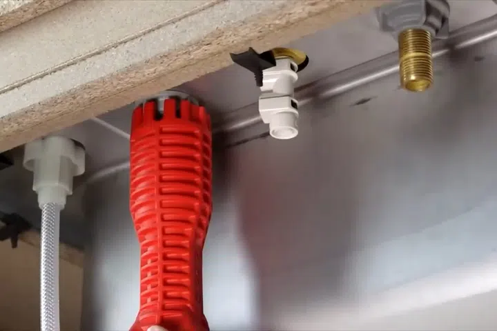 Close-up of a plumbing repair tool or fitting being used on pipe or fixture work for Contact GoodYear AZ Plumbing Experts