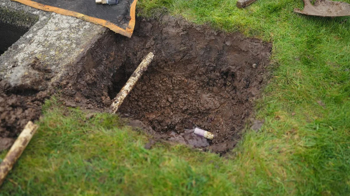 Exposed water line connection being repaired near an outdoor or utility access point for Gas Line Installation & Repair in Goodyear