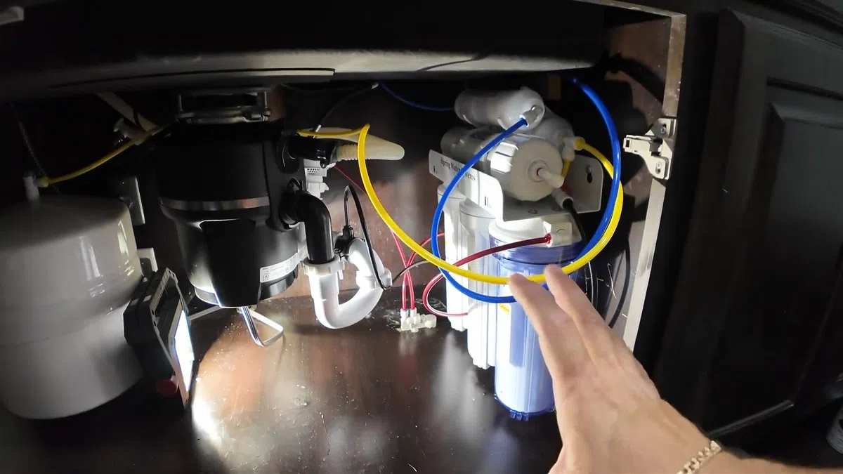 Garbage disposal and dishwasher drain connections below a kitchen sink for Garbage Disposal Repair & Installation in Goodyear