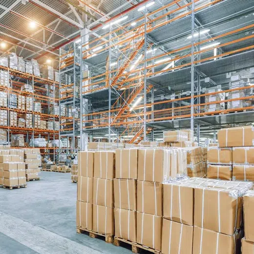 Large commercial warehouse interior with plumbing access and service space for Plumbing Services in Goodyear