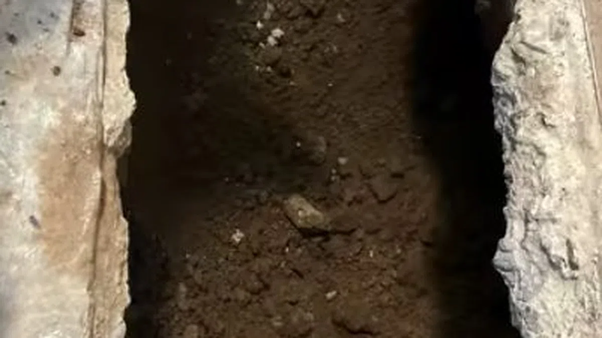 Opened slab area and leak detection equipment used to locate a hidden pipe leak for Plumbing Services in Peoria,