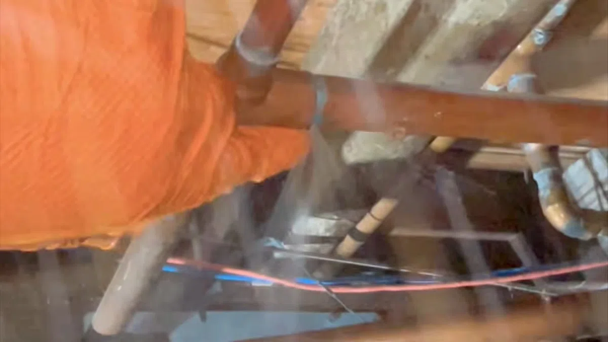 Opened slab area and leak detection equipment used to locate a hidden pipe leak for Water Line Repair & Replacement in Goodyear