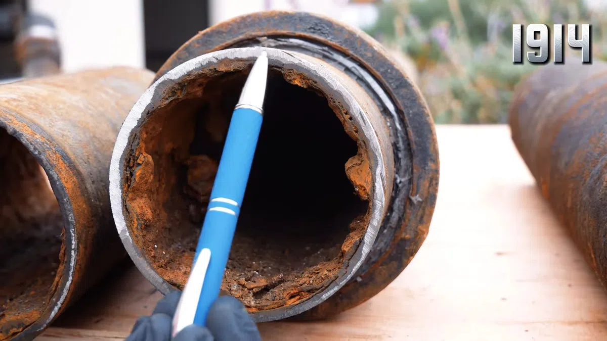 Rusted cast iron pipe sections showing corrosion and interior buildup for Plumbing Services in Tolleson,