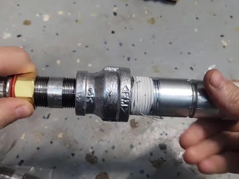 Tank water heater connections, valve fittings, and service components for Water Filtration Installation in Goodyear showing tank water heater connections valve fittings components filtration installation body detail