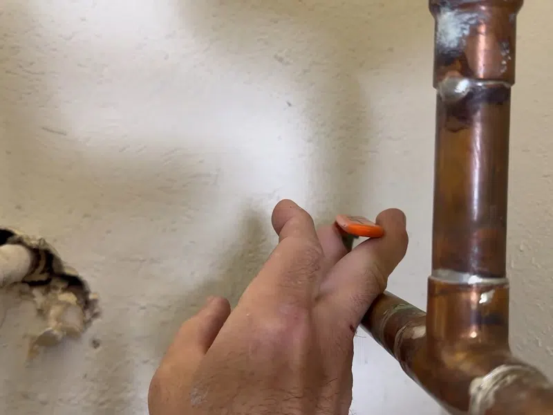 Tank water heater connections, valve fittings, and service components for Tankless Water Heater Services in Goodyear showing tank water heater connections valve fittings components tankless body detail