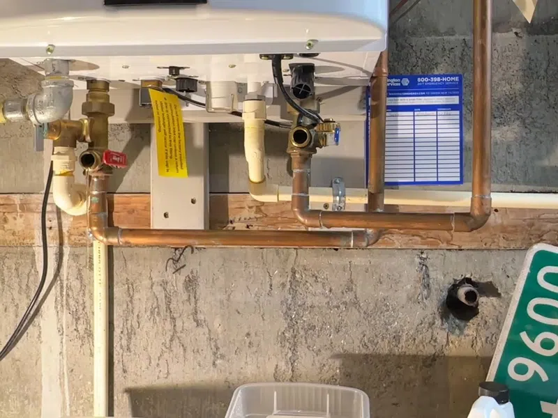 Tankless water heater connections and descaling service equipment for Water Heater Installation & Replacement in Goodyear showing tankless water heater connections descaling equipment installation replacement body