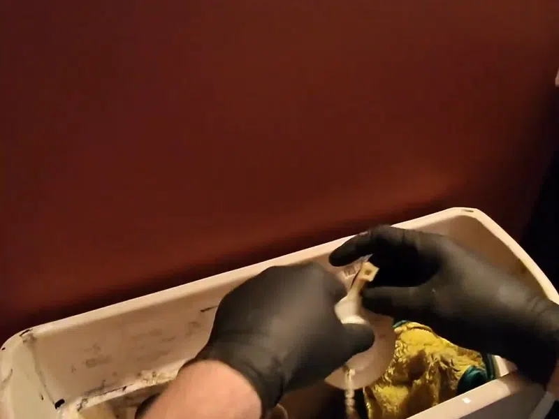 Toilet tank repair parts and fill valve components during a fixture service for Reverse Osmosis Installation in Goodyear