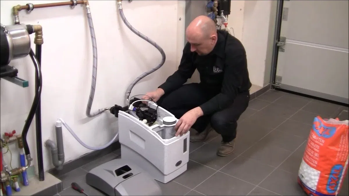 Whole-home water softener with control valve, brine tank, and plumbing connections for About GoodYear AZ Plumbing Experts