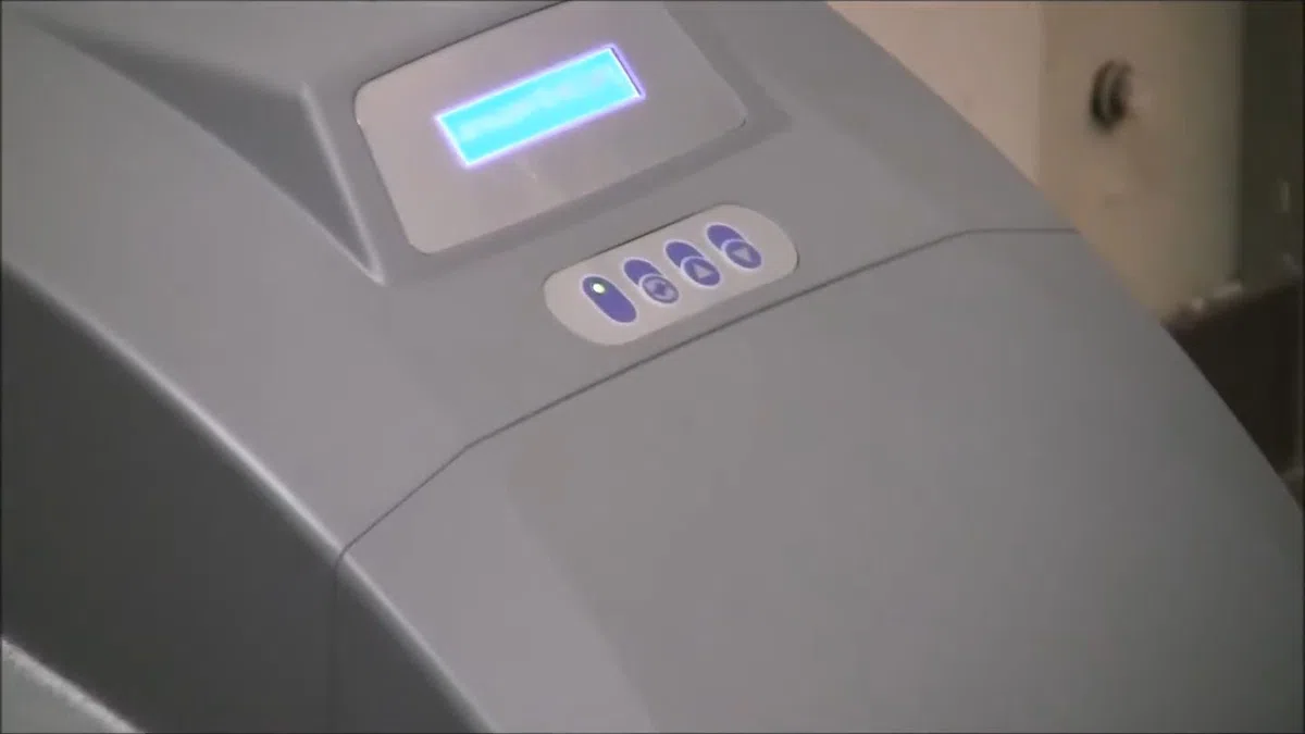 Whole-home water softener with control valve, brine tank, and plumbing connections for Plumbing Services in Avondale,