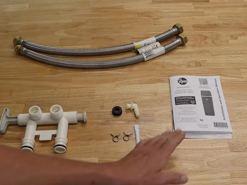 Whole-home water softener with control valve, brine tank, and plumbing connections for Plumbing Services in Goodyear showing whole water softener control valve brine tank connections body