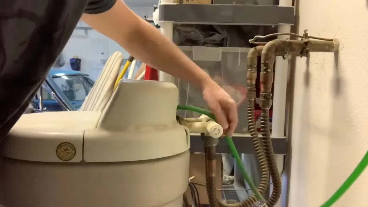 Whole-home water softener with control valve, brine tank, and plumbing connections for Plumbing Services in Buckeye,