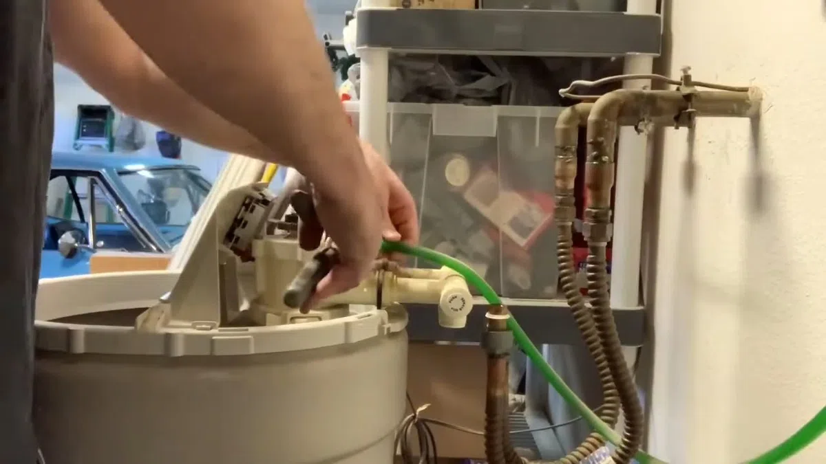 Whole-home water softener with control valve, brine tank, and plumbing connections for Plumbing Services in Cashion,
