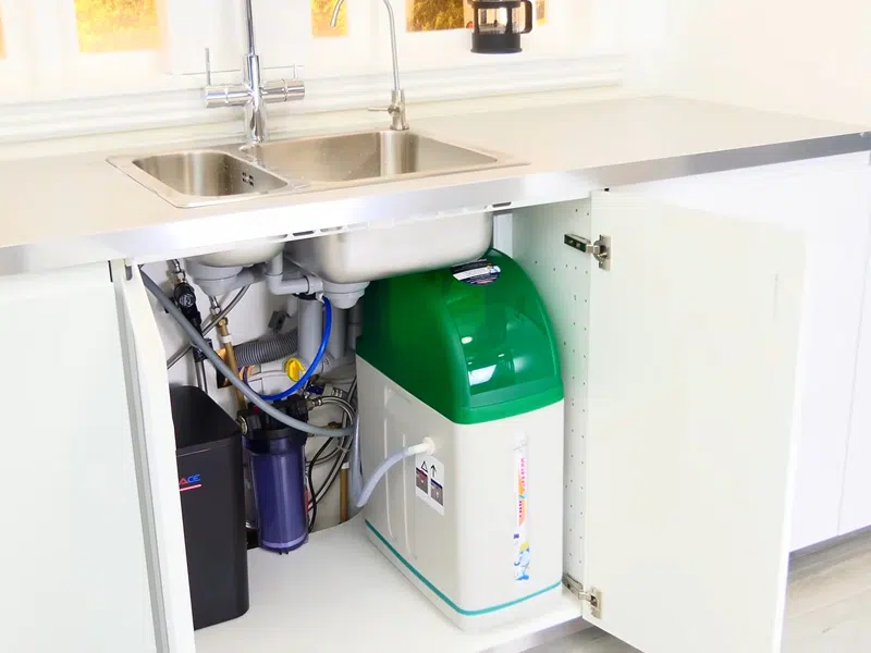 Whole-home water softener with control valve, brine tank, and plumbing connections for Plumbing Services in Estrella Mountain Ranch, Goodyear