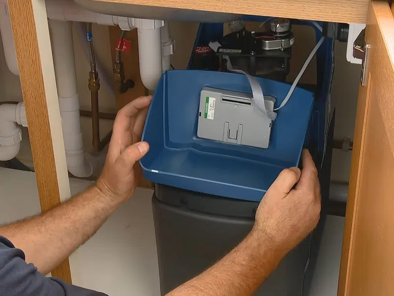 Whole-home water softener with control valve, brine tank, and plumbing connections for Water Heater Repair in Goodyear