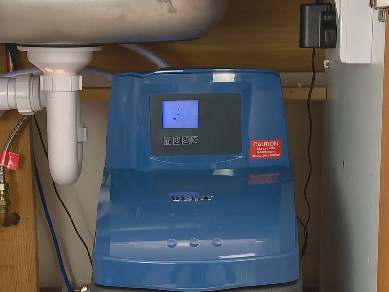 Whole-home water softener with control valve, brine tank, and plumbing connections for Water Softener Installation & Repair in Goodyear showing whole water softener control valve brine tank connections installation repair body