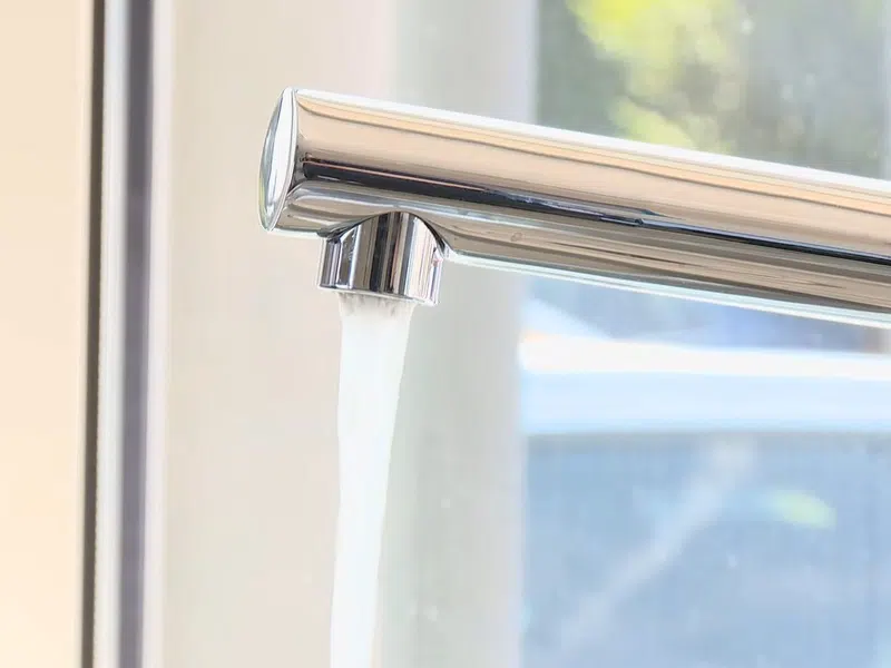 Whole-home water softener with control valve, brine tank, and plumbing connections for Plumbing Services in Peoria,