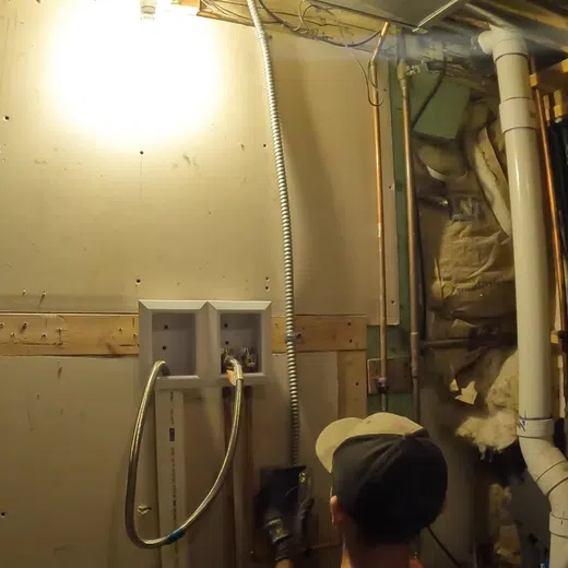 Plumber working on residential plumbing components for Plumbing Service Areas in the West Valley showing working residential components thumbnail setup