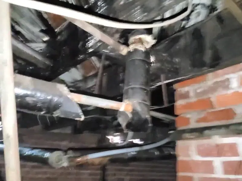 Plumber working on residential plumbing components for Plumbing Services in Waddell,